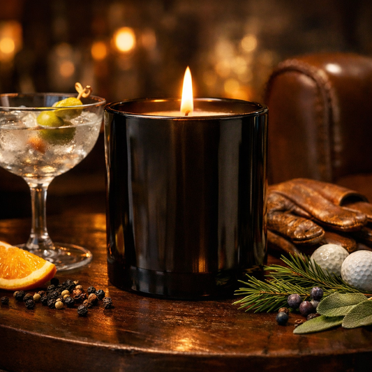 The 19th Candle luxury golf-inspired candle on wooden surface with golf accessories